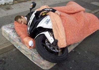 Man-Sleeping-With-Bike-Funny-Picture.jpg