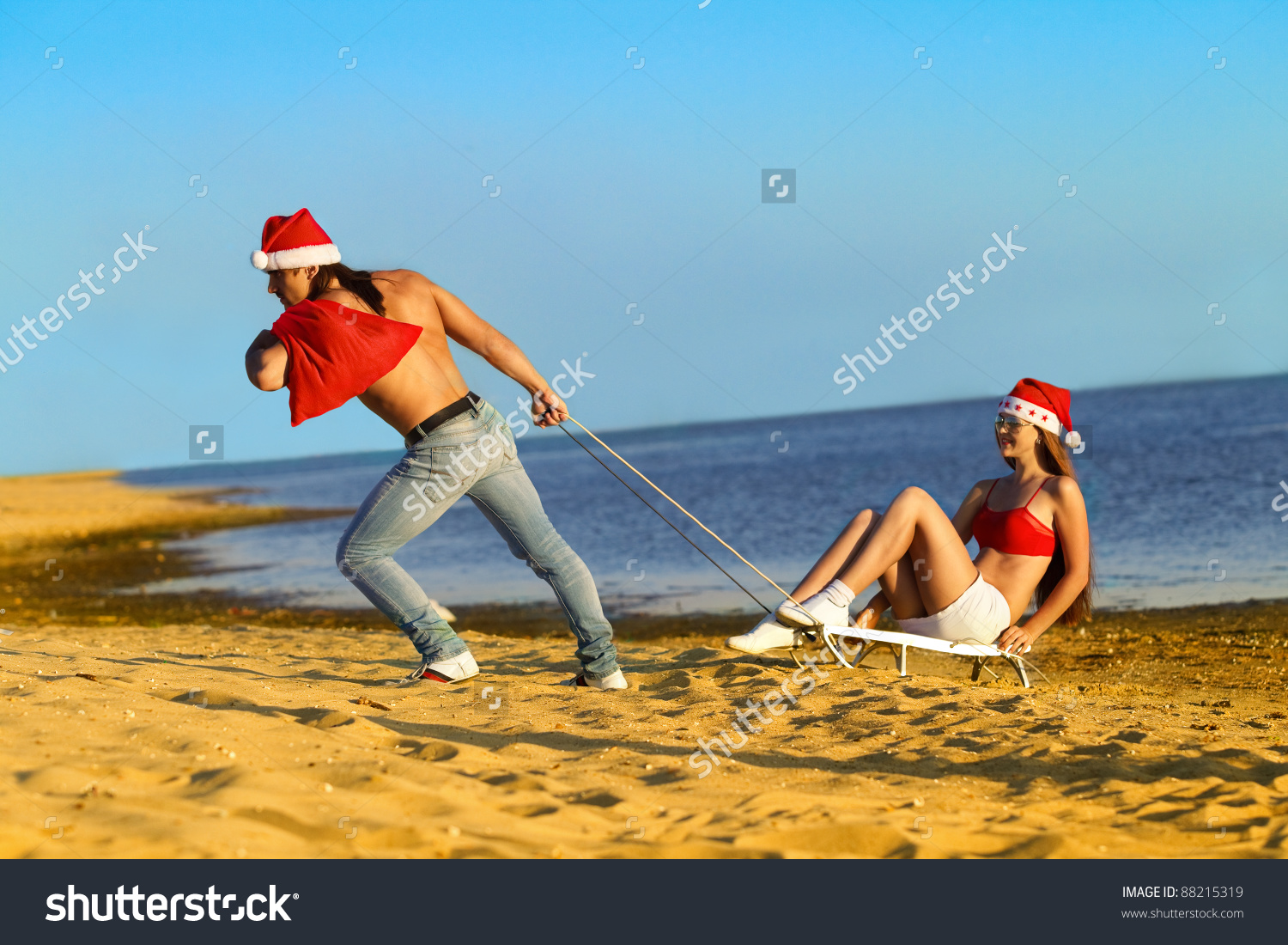 stock-photo-santa-pulling-sexy-santa-gir